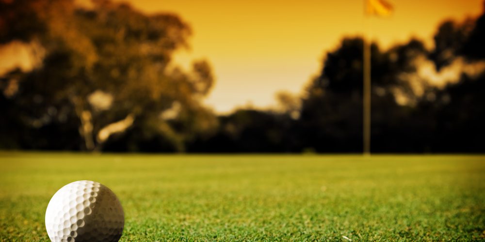 A,Long,Putt,On,The,18th,Green,As,Sunset,Closes